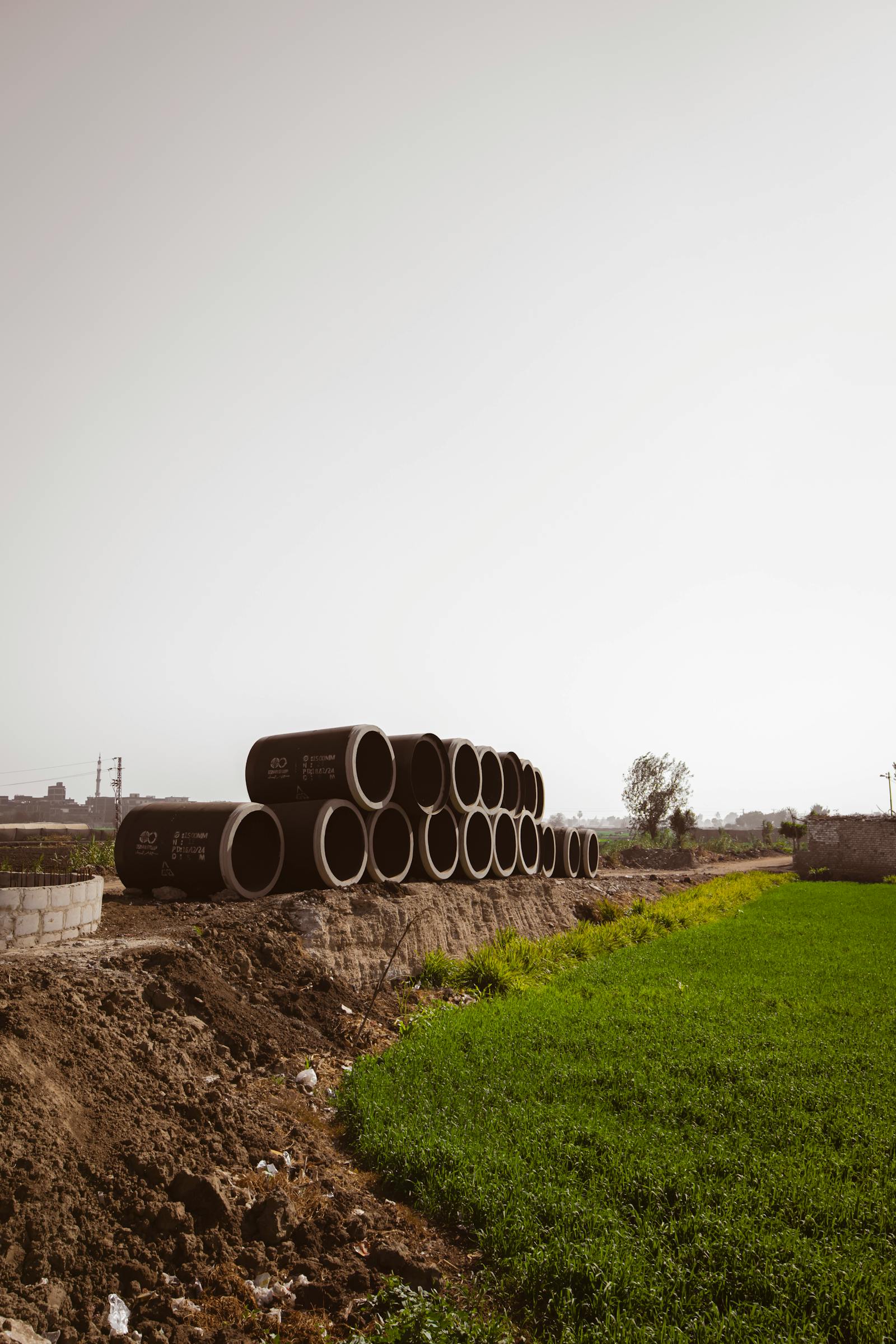 Concrete drainage pipes ready to lay on a rural job